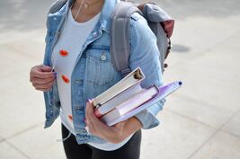 Woman carrying books